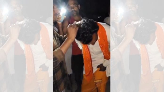 A clip from the video showing the tonsuring of a Yadav preacher and his aide Sunday night | X/@yadavakhilesh