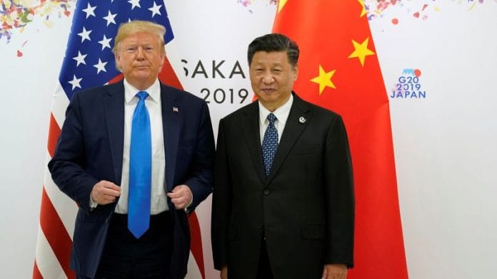 U.S. President Donald Trump and China's President Xi Jinping pose for a photo ahead of their bilateral meeting during the G20 leaders summit in Osaka, Japan, on 29 June 2019. | Kevin Lamarque | Reuters