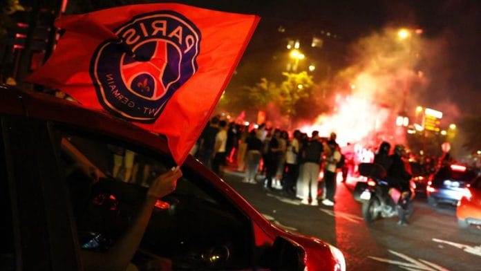 Victory celebrations turn violent as fans gather post Paris St Germain's win in Champions League Saturday | Reuters/Tom Nicholson