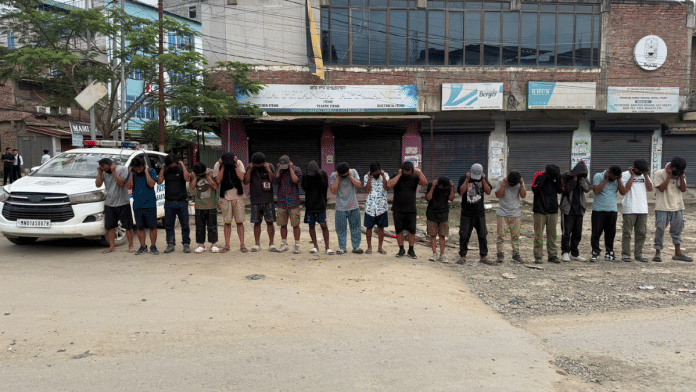 Offenders made to hold their ears as an apology for allegedly creating public nuisance during curfew hours in Manipur's Imphal East district | By Special Arrangement
