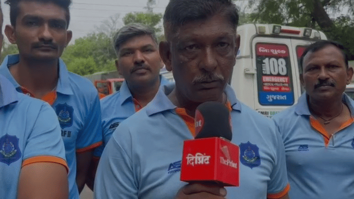 Screengrab from video showing Dharmendra Prajapati of Gujarat State Disaster Response Force | Manasi Phadke | ThePrint