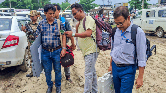 Election officials head to polling booths after collection of election material from a distribution centre on the eve of Kaliganj bypoll in Nadia on Wednesday | PTI