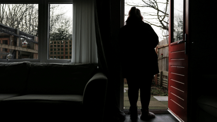 woman poses at her home in England January 8, 2025. She was 14 when she was sexually abused by grooming gang in Rochdale | Reuters/Hollie Adams/File Photo