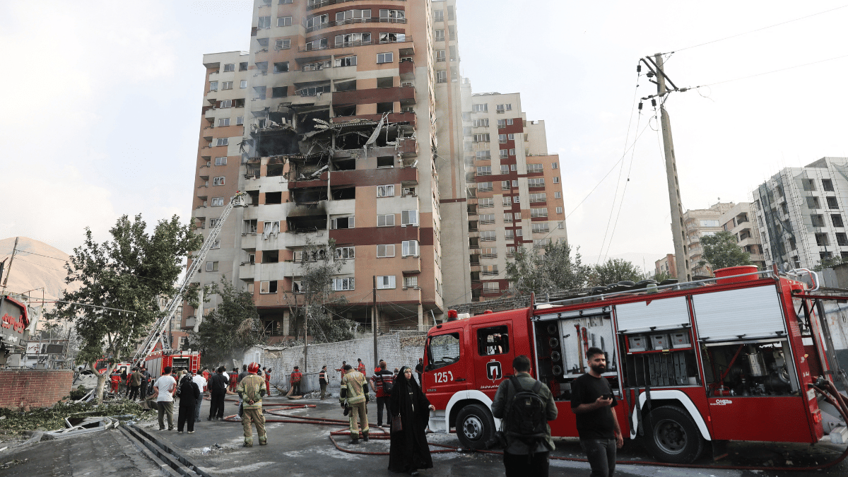Firefighters at the scene of a damaged building in the aftermath of Israeli strikes in Tehran Friday. Reuters/ANI
