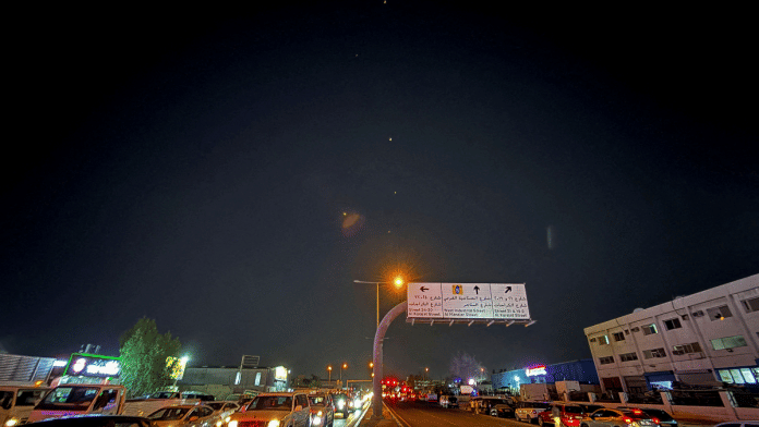 Traces are seen in the sky after Iran's armed forces say they targeted The Al-Udeid base in a missile attack, as seen from Doha, Qatar Monday. | Reuters