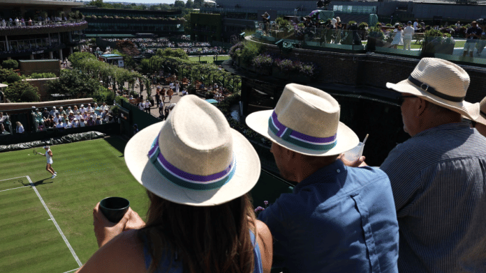 Spectators in the stands of court 18 during the first round match between Ukraine's Elina Svitolina & Hungary's Anna Bondar at All England Lawn Tennis & Croquet Club, London on 30 June 2025. | Toby Melville | Reuters