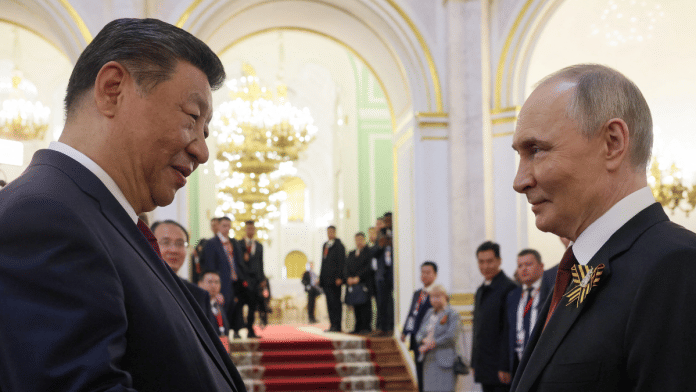 Russian President Vladimir Putin shakes hands with Chinese President Xi Jinping | File Photo | Reuters