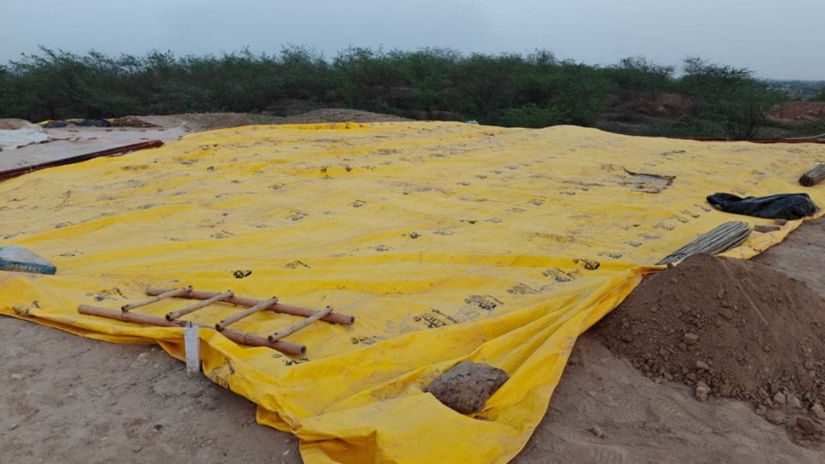 The wall has now been covered with yellow tarpaulin sheets to protect it from the elements