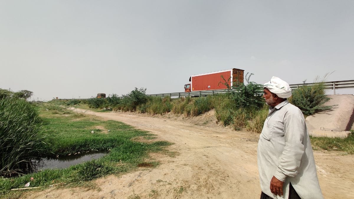 A farmer at Golipura Village looks on at the highway that goes through his village | Shubhangi Misra, ThePrint