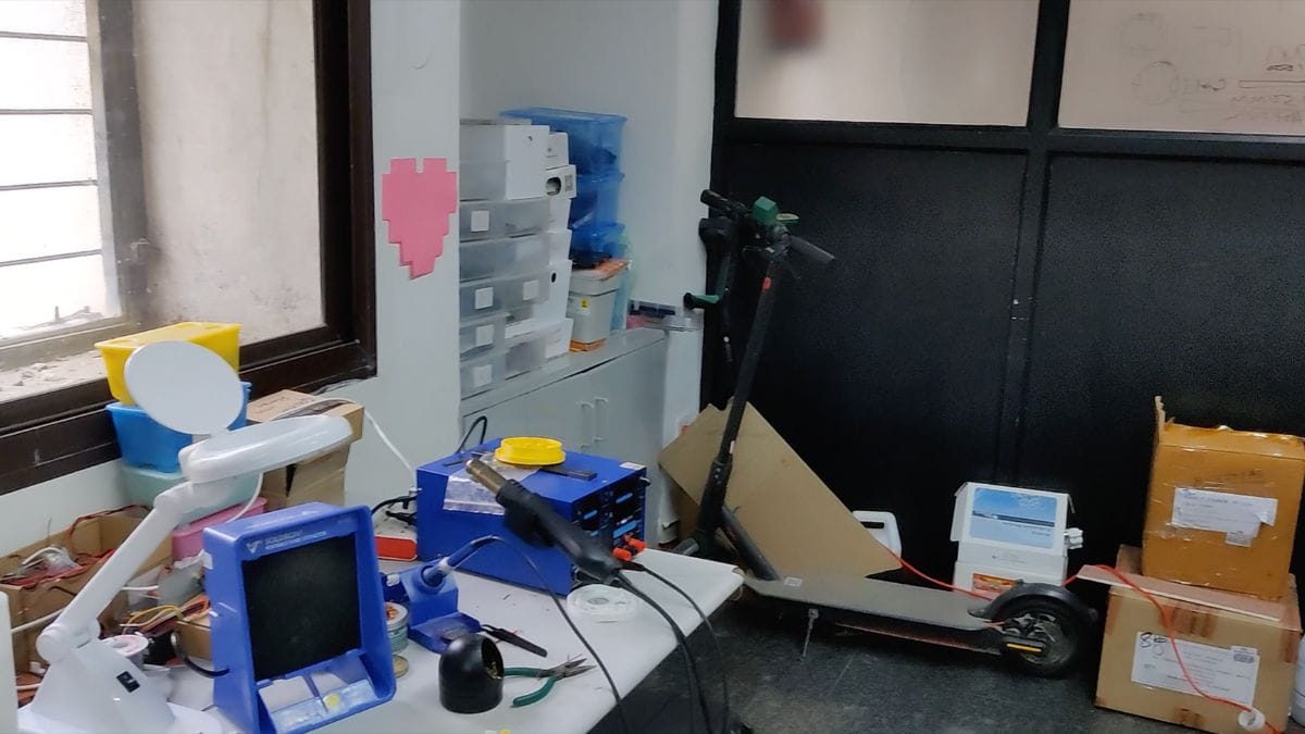 With boxes, cartons, and equipment strewn around, the office looks more like an engineer's workshop