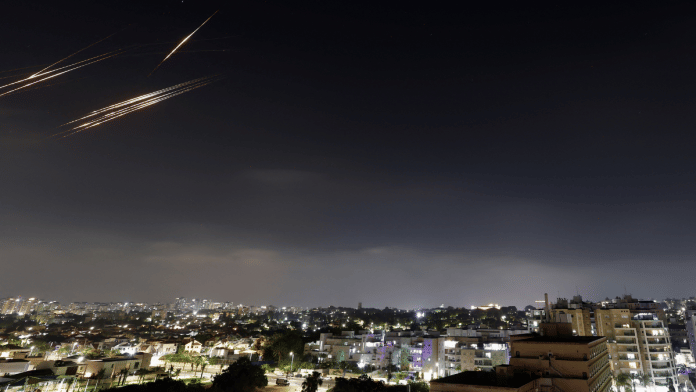 Missiles launched from Iran are intercepted, as seen from the city of Ashkelon, Israel, on 13 June 2025. | Amir Cohen | Reuters