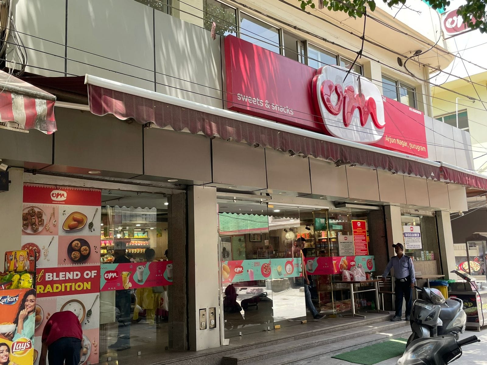 Facade of the first Om Sweets outlet in Arjun Nagar, now renovated with a modern look.
