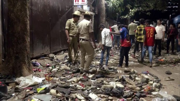 A number of shoes and slippers lying outside Chinnaswamy Stadium after the stampede Wednesday | ANI