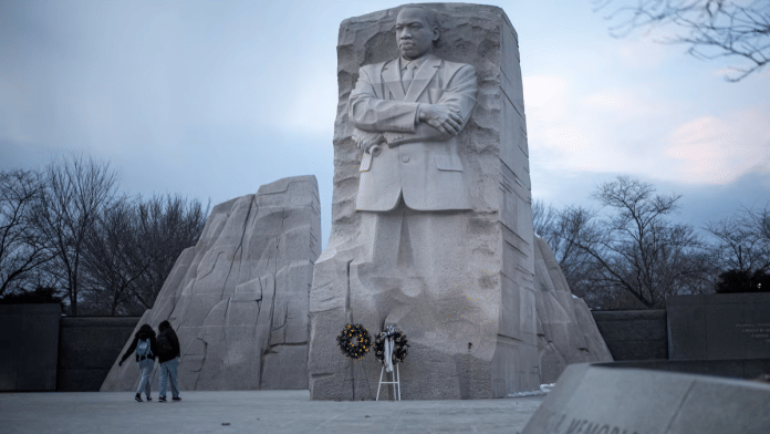 People walk by the Martin Luther King, Jr. Memorial, ahead of the presidential inauguration of U.S. President-elect Donald Trump, in Washington, U.S., January 16, 2025 | Reuters
