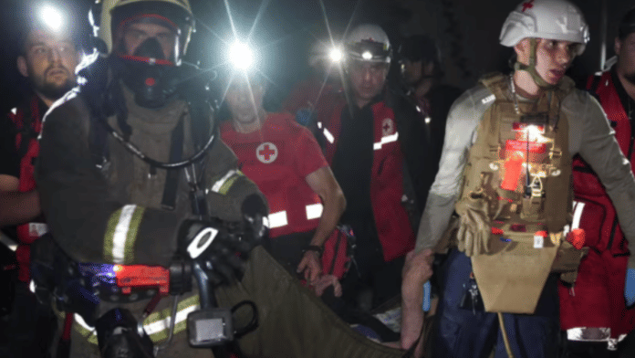 Rescuers and medical workers evacuate a resident from an apartment building damaged during a Russian drone strike, amid Russia's attack on Ukraine, in Odesa, Ukraine in this handout picture released July 19, 2025. Press service of the State Emergency Service of Ukraine in Odesa region | Reuters