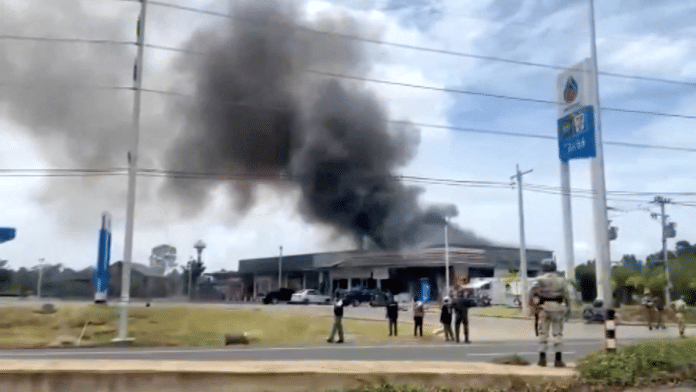 Smoke rises from a convenience store at a gas station, amid the clashes between Thailand and Cambodia, in Kantharalak district, Sisaket province, Thailand| TPBS/Handout via REUTERS