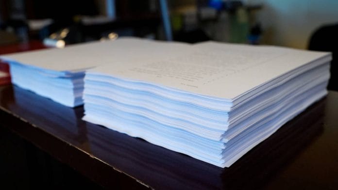 A copy of the spending and tax bill is seen on a desk in the Senate chamber on Capitol Hill in Washington | Photo: Reuters