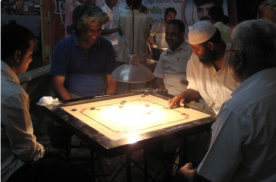 A game of carrom being played in India, 2008