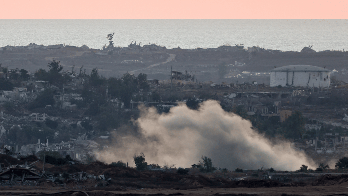 Smoke rises in Gaza, as seen from the Israeli side of the border, on 5 July 2025.| Amir Cohen | Reuters