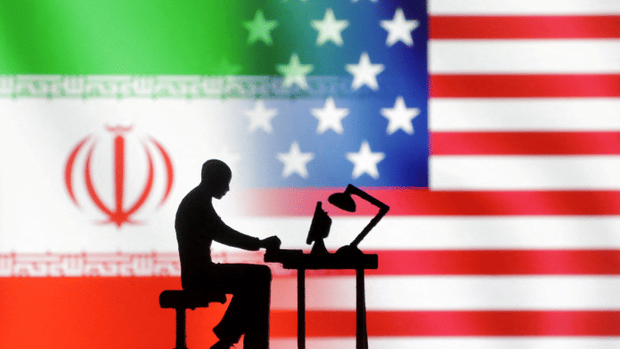 Figurines with computers are seen in front of USA and Iran flags in this illustration taken, September 10, 2022 | Reuters