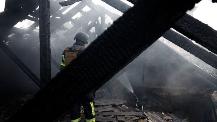 Firefighters work on a roof of an apartment building, damaged during Russian drone and missile strikes, amid Russia's attack on Ukraine, in Kyiv, Ukraine on 10 July 2025. | Valentyn Ogirenko | Reuters