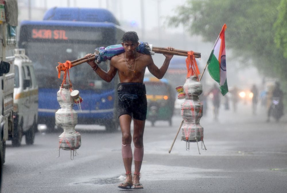 A kanwariya carrying water from the river Ganga to his native village crossing New Delhi | Suraj Singh Bisht