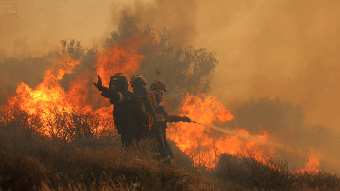 Firefighters douse wildfire near Greek island of Crete | Reuters