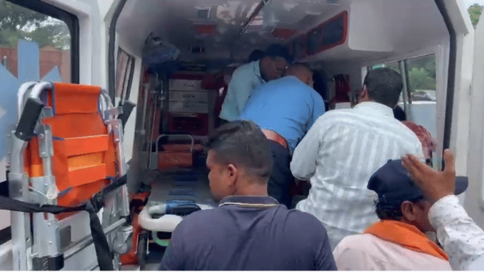 Screengrab showing rescuers shifting the elderly man to an ambulance | By Special Arrangement
