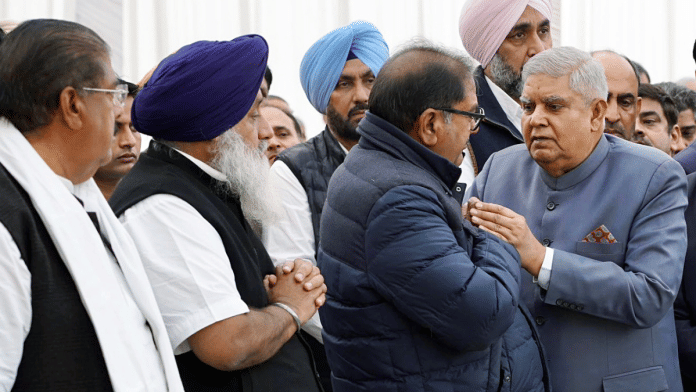 File photo of Jagdeep Dhankhar consoling INLD secretary general Abhay Singh Chautala after the then vice president arrived to pay last respects to the late Om Prakash Chautala | ANI