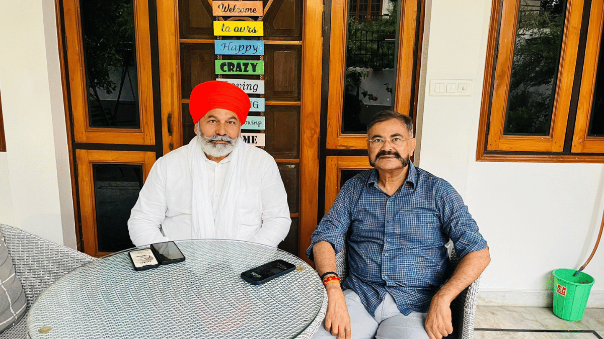 Farmer leader Rakesh Tikait and former UP DGP Prashant Kumar in a photo shared on X by the retired IPS officer. X| @PrashantK_IPS90