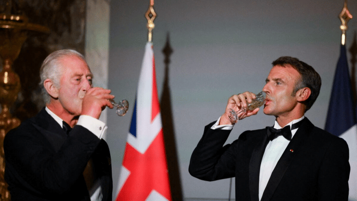 Britain's King Charles and French President Emmanuel Macron drink after a toast during a state banquet at the Palace of Versailles, west of Paris, on September 20, 2023, on the first day of a British royal state visit to France | File photo | Reuters