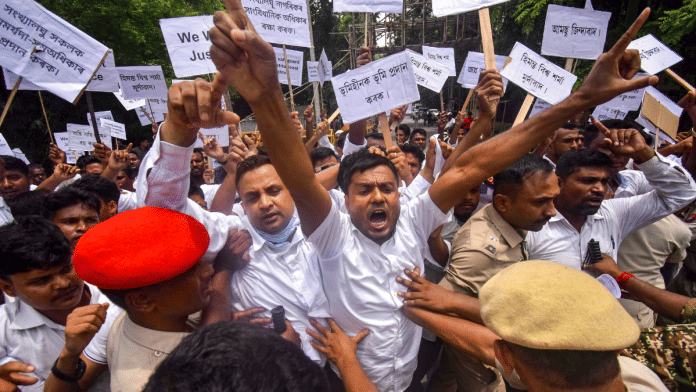 Members of All Assam Minorities Students' Union protest 12 July in Nagaon district against eviction drives in state | PTI Photo