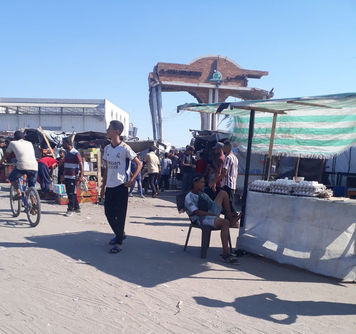 The broken gate of the Al Aqsa University in the background, people are now sheltering in the area | Courtesy: Donya Abu Sitta | ThePrint