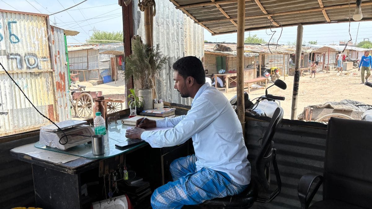 Scrap dealer Asad Ul working at his shop outside the Sector 70 neighbourhood | Samridhi Tewari, ThePrint