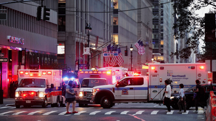 Media members walk past an emergency services vehicle near the scene of a reported shooter situation in the Manhattan borough of New York City, U.S. July 28, 2025 | Reuters