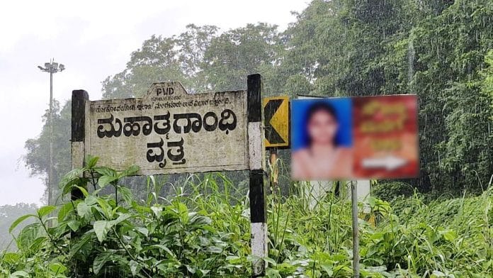A signboard giving directions to the home of a rape and murder victim whose body was found in Dharmasthala. The family put them up because pressure around her case is such that people here refuse to give directions to her home | Sharan Poovanna