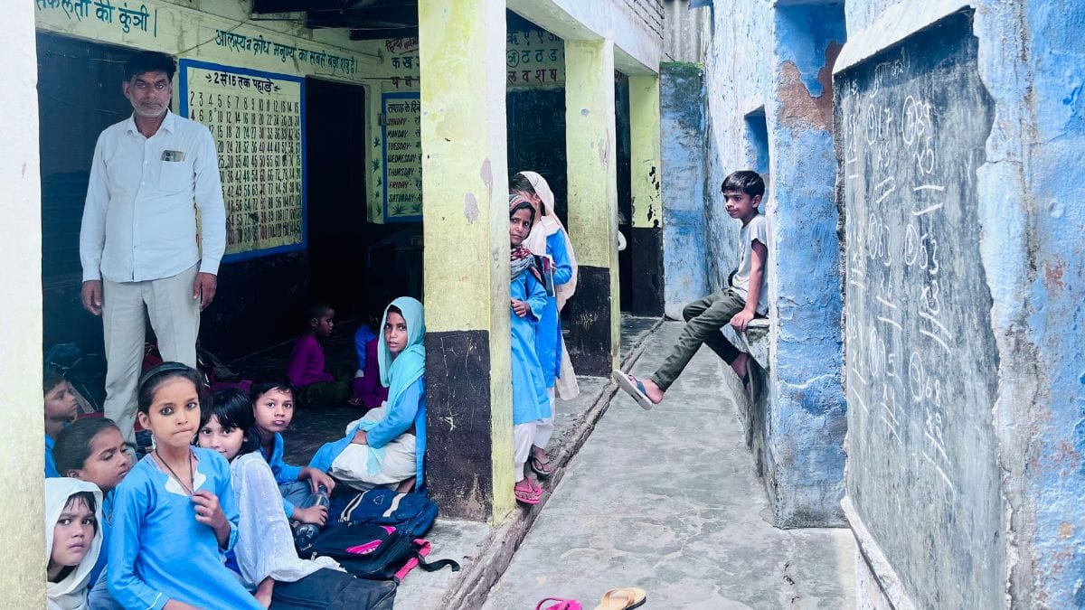Ahmed Hussain with his students at the govt primary school in Dhond-Khurd | Fareeha Iftikhar | ThePrint