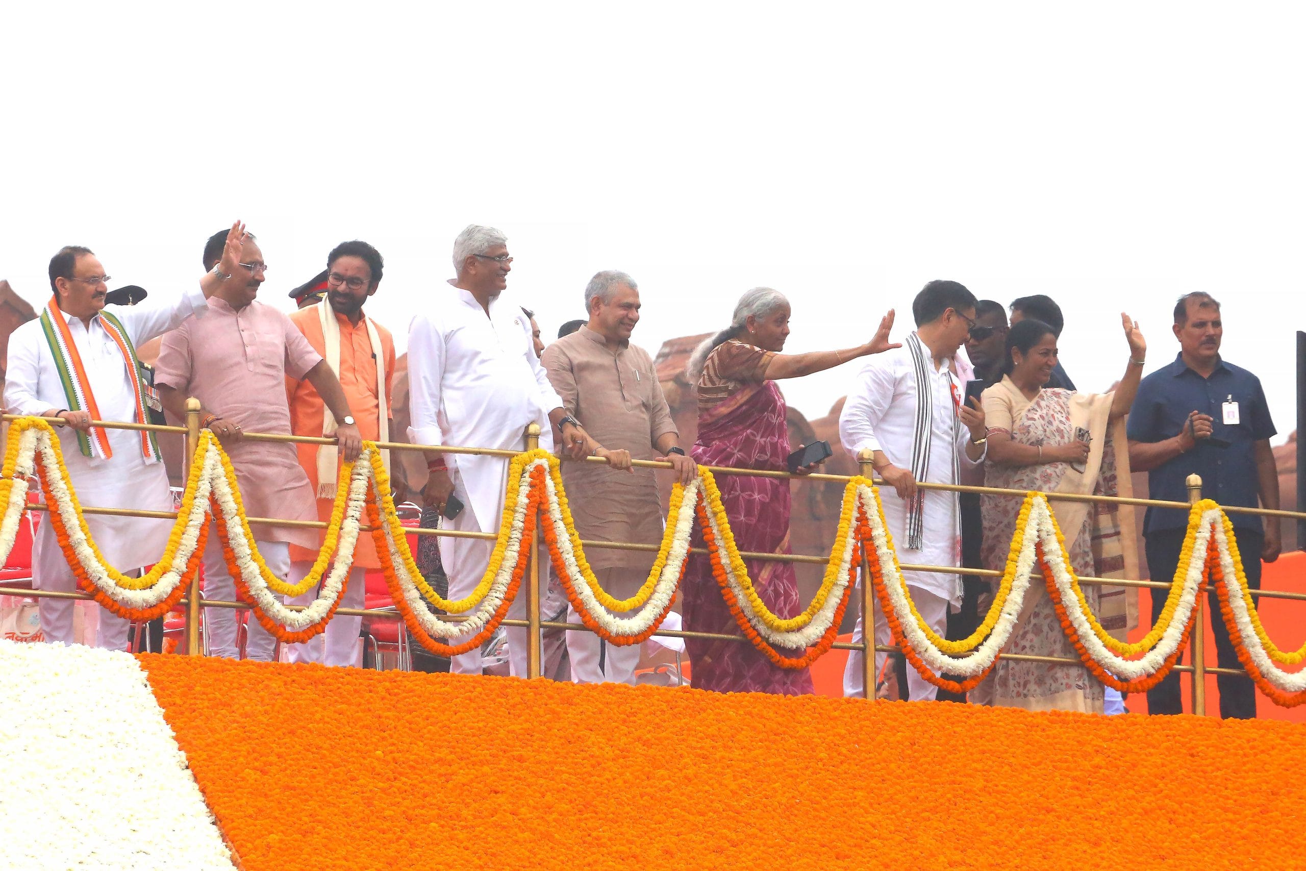 Modi's ministers JP Nadda, G. Kishan Reddy, Gajendra Singh Shekhawat, Ashwani Vaishnav, Nirmala Sitharaman and Kiren Rijiju along with Delhi CM Rekha Gupta and Delhi BJP chief Virendra Sachdeva waving to the crowd | Praveen Jain | ThePrint