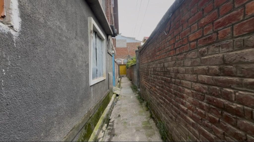 The narrow lane leading to Sarla Bhat’s house in Anantnag’s Qazibagh. It’s where she and her family lived before they fled Kashmir. | Sagrika Kissu | ThePrint