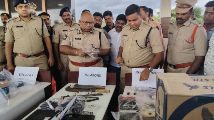 Kurnool range DIG Koya Praveen and Annamayya district SP Vidya Sagar Naidu with explosive devices, weapons and fundamentalist literature seized from terror suspects’ houses in Andhra Pradesh's Rayachoti in July | Photo by special arrangement