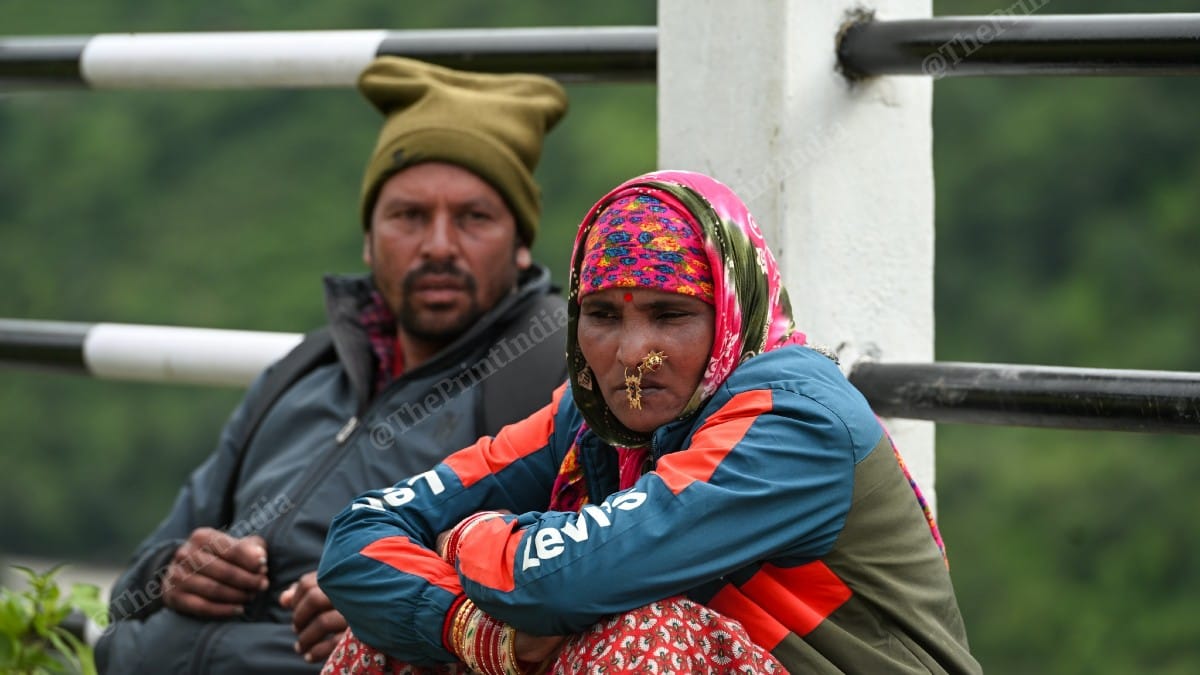 Peer Singh and wife Kali Devi, both migrant workers from Nepal, at Bhatwari helipad | Suraj Singh Bisht | ThePrint