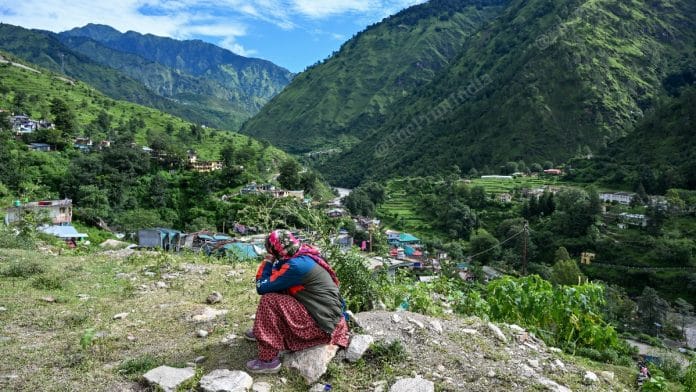 Kali Devi, who is a road construction worker with BRO, waiting for a helicopter at Bhatwari helipad | Suraj Singh Bisht | ThePrint