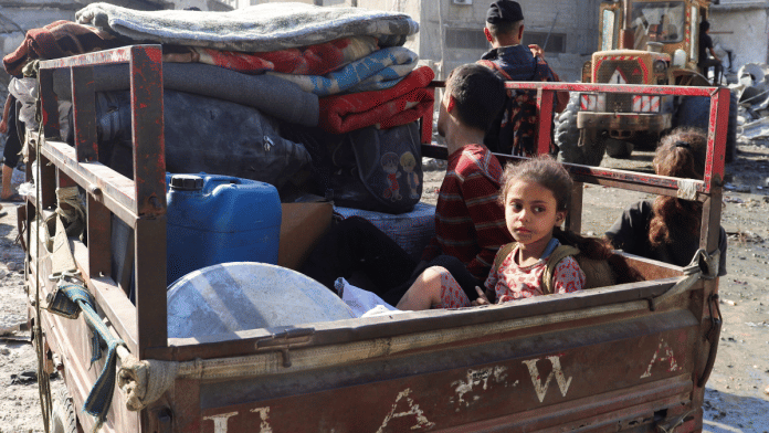 A Palestinian child looks on as she sits in a vehicle, at the site of an overnight Israeli strike on a house, in Gaza City, August 26, 2025 | Reuters