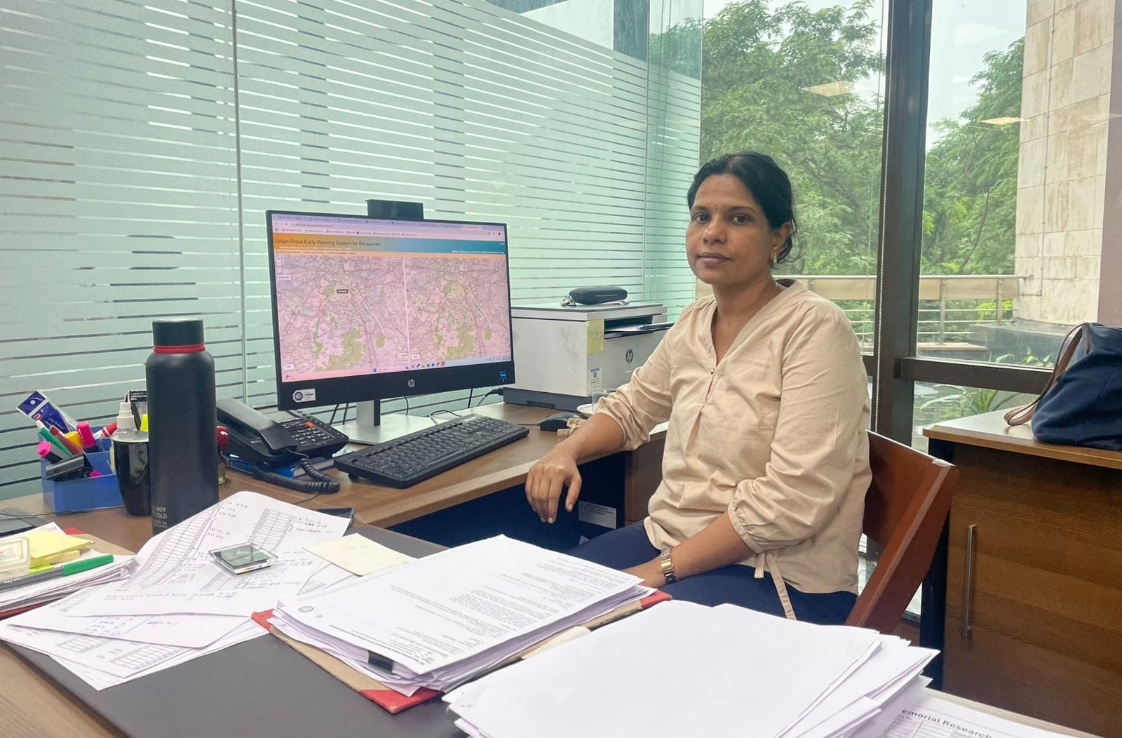 IIT Delhi professor Dhanya CT showing the early warning system developed at the institute. Coloured dots highlight different depths of inundations | Photo: Udit Hinduja