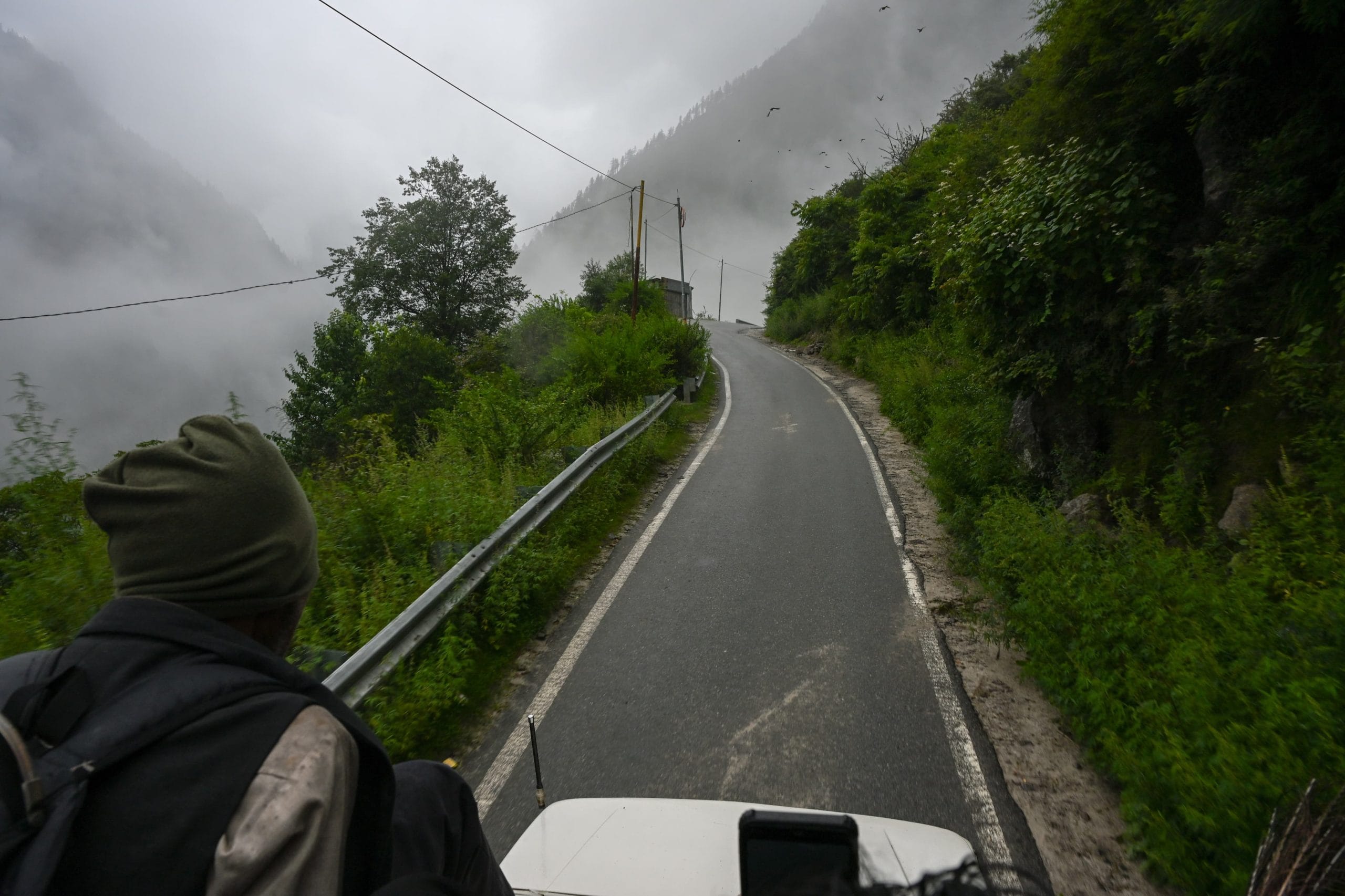 After walking about 10 kilometres, we found a taxi, but there was no space in it so I had to sit on the roof. | Photo: Suraj Singh Bisht | ThePrint