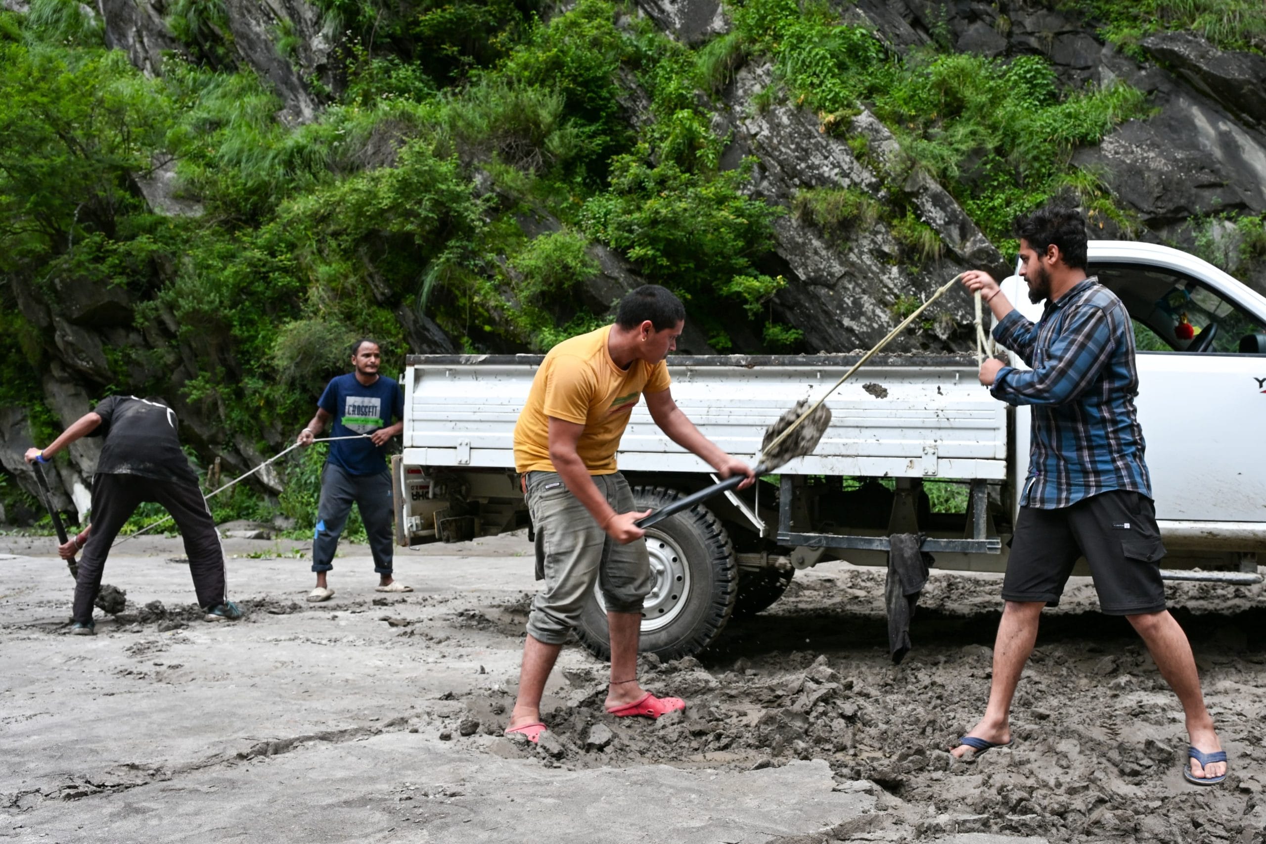 Workers clearing the debris from the road | Photo: Suraj Singh Bisht | ThePrint