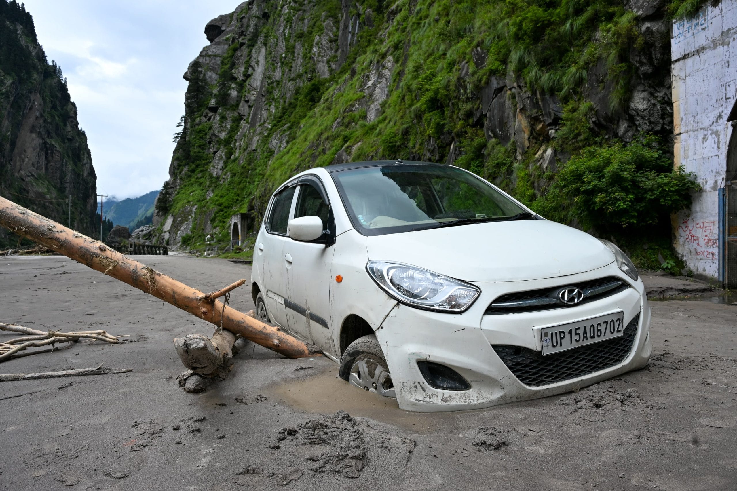 A car stuck in a debris at Uttarkashi-gangotri road | Photo: Suraj Singh Bisht | ThePrint