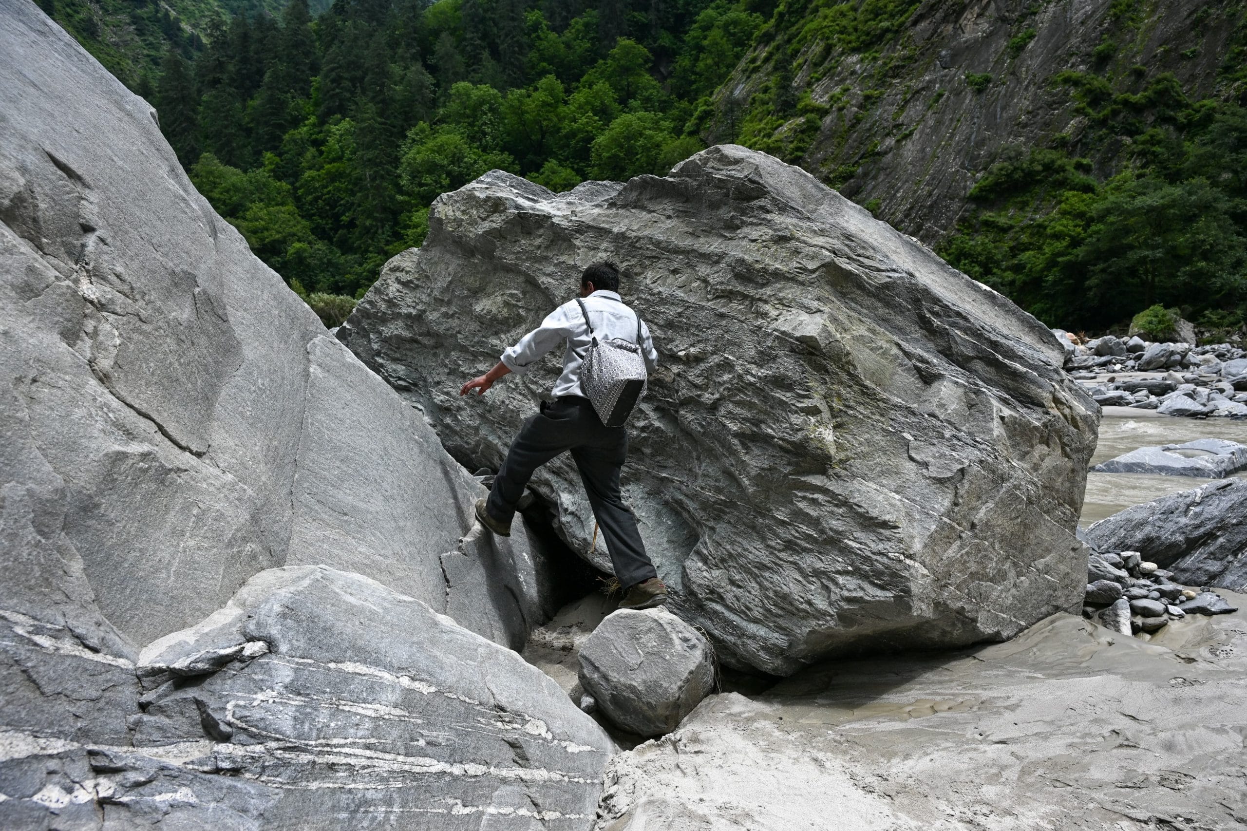 A man climb the rock to reach his village | Photo: Suraj Singh Bisht | ThePrint