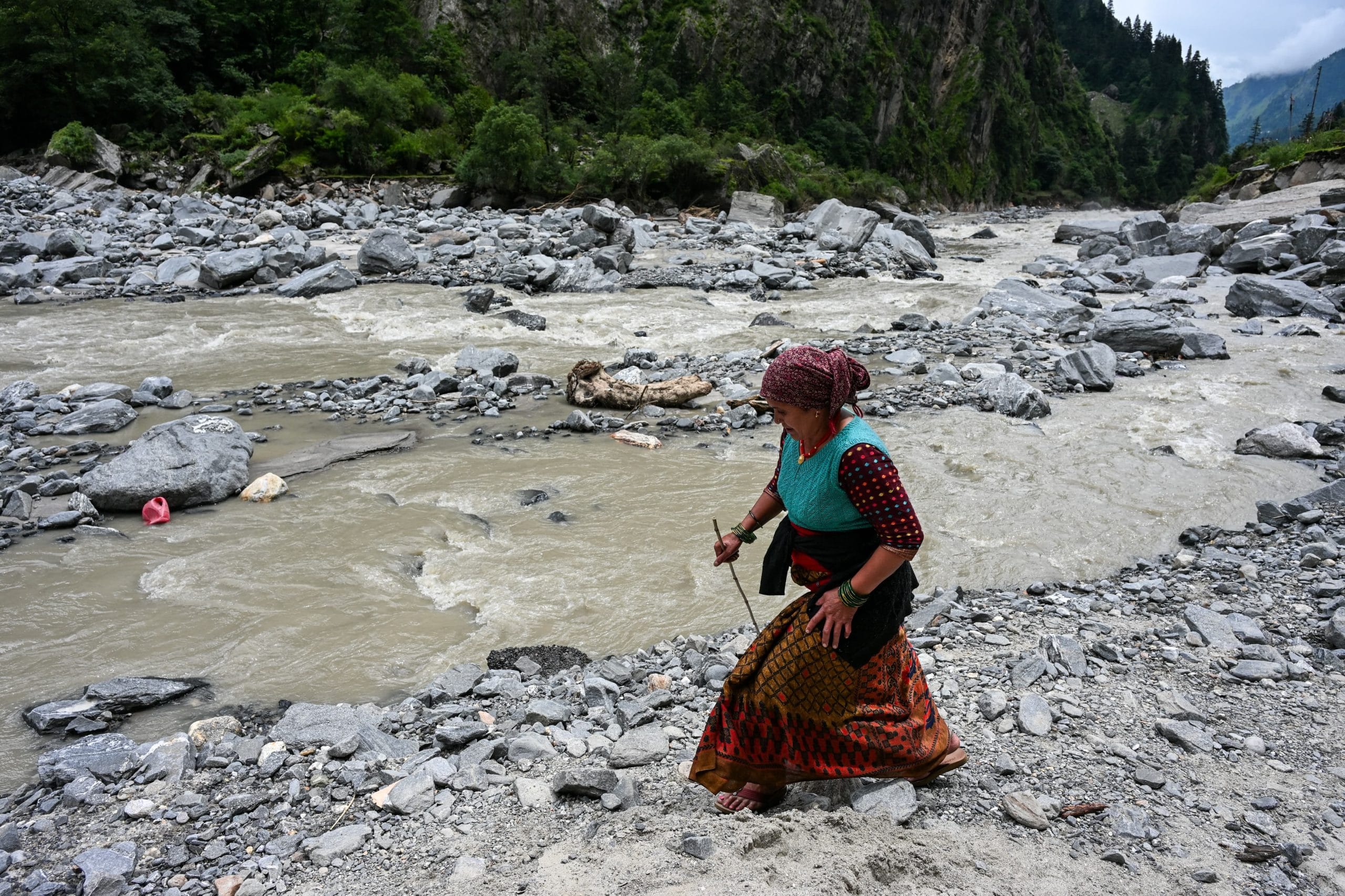 A women passing near the Bhagirathi river to reach her village | Photo: Suraj Singh Bisht | ThePrint