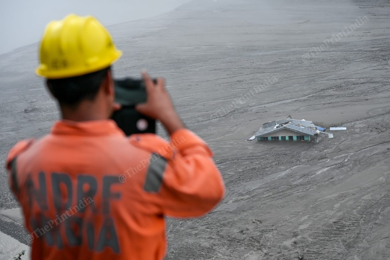 NDRF personnel taking pictures of Dharali | Suraj Singh Bisht | ThePrint